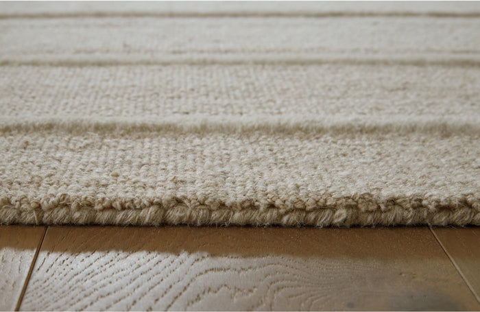 Teelgan 5' x 7' Medium Rug in Ivory/Tan