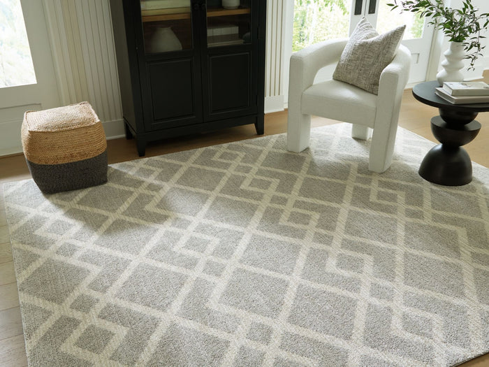 Unawick 5' x 7' Medium Rug in Gray/Ivory